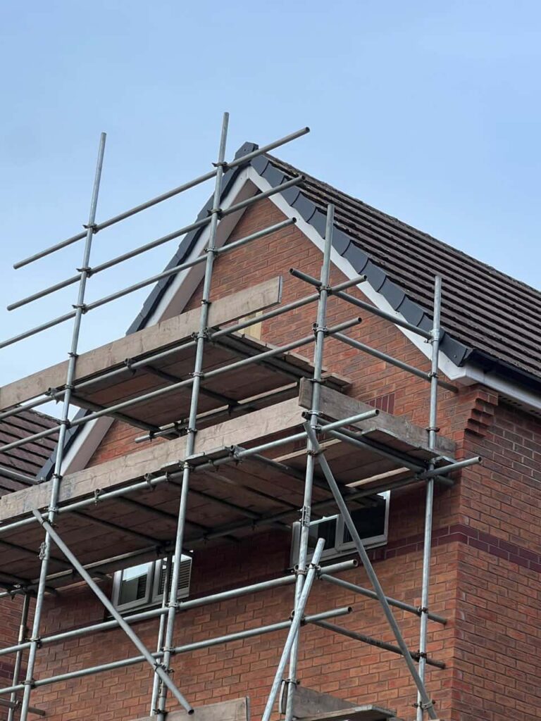 This is a photo of a roof which has just been repaired. There is a scaffold located at the gable end for access onto the roof. Works carried out by TRP Roofing Withernsea